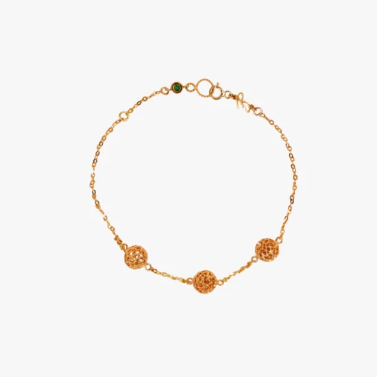 Pulsera tres esferas filigrana caracol Bauer Herencias oro amarillo 18K y esmeralda